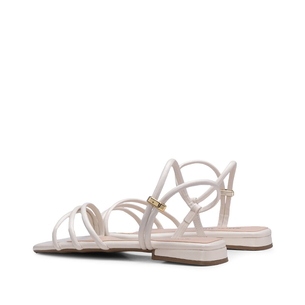 Sandalias planas de tacón beige para mujer